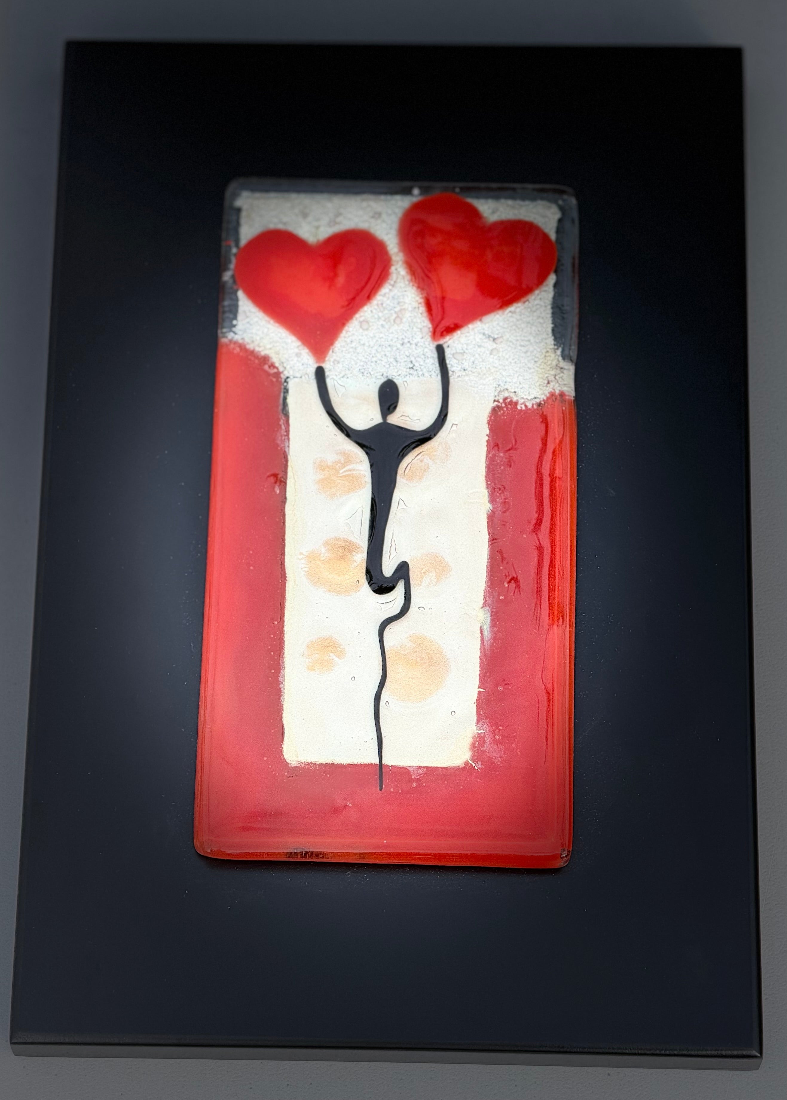 Figure Holding Hearts - Fused Glass Wall Art with Black Panel