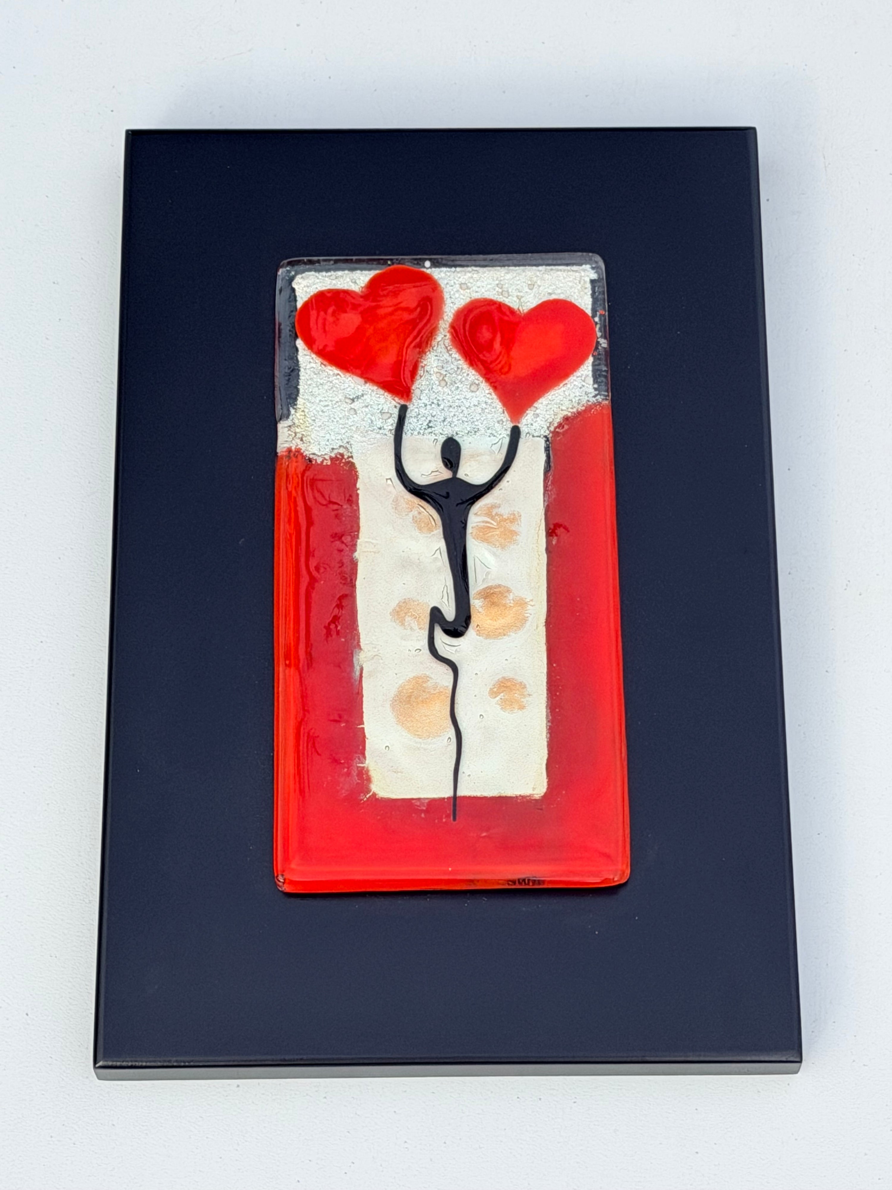 Figure Holding Hearts - Fused Glass Wall Art with Black Panel
