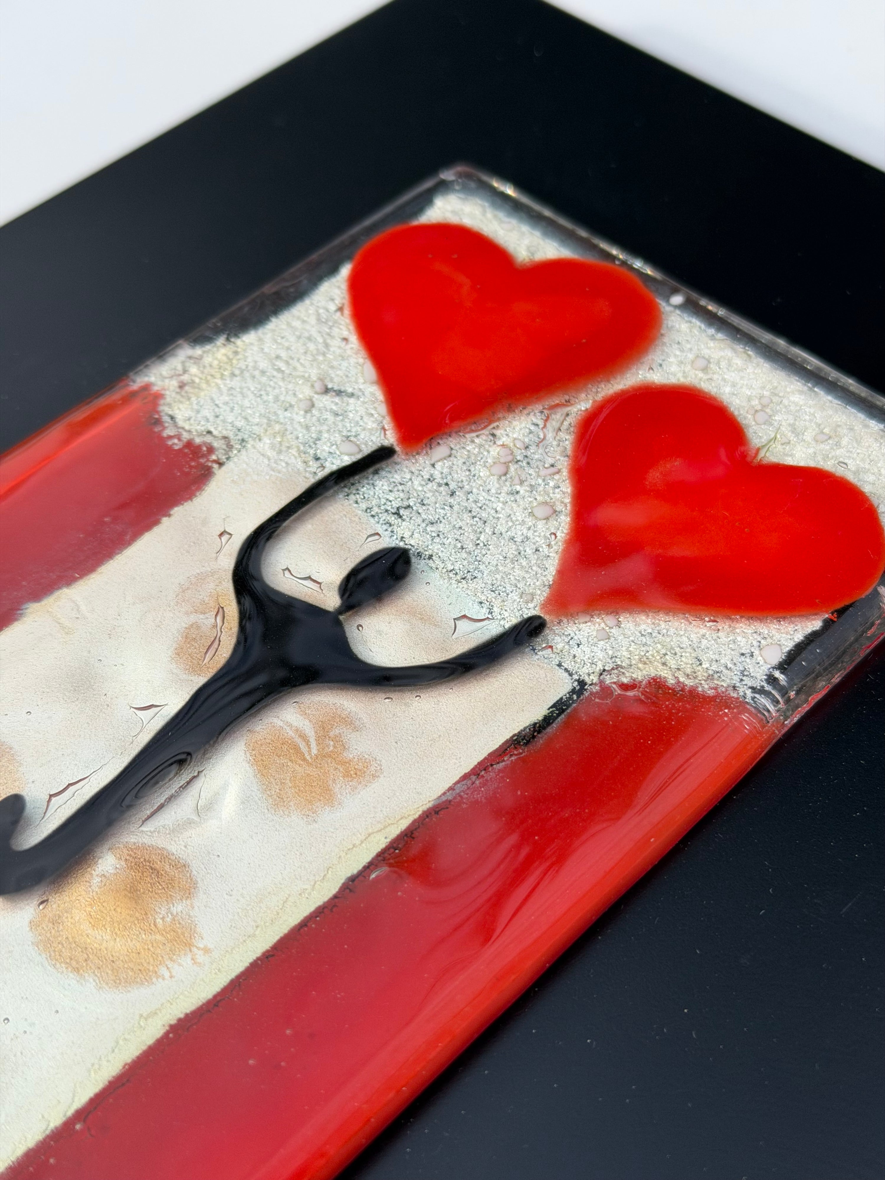 Figure Holding Hearts - Fused Glass Wall Art with Black Panel