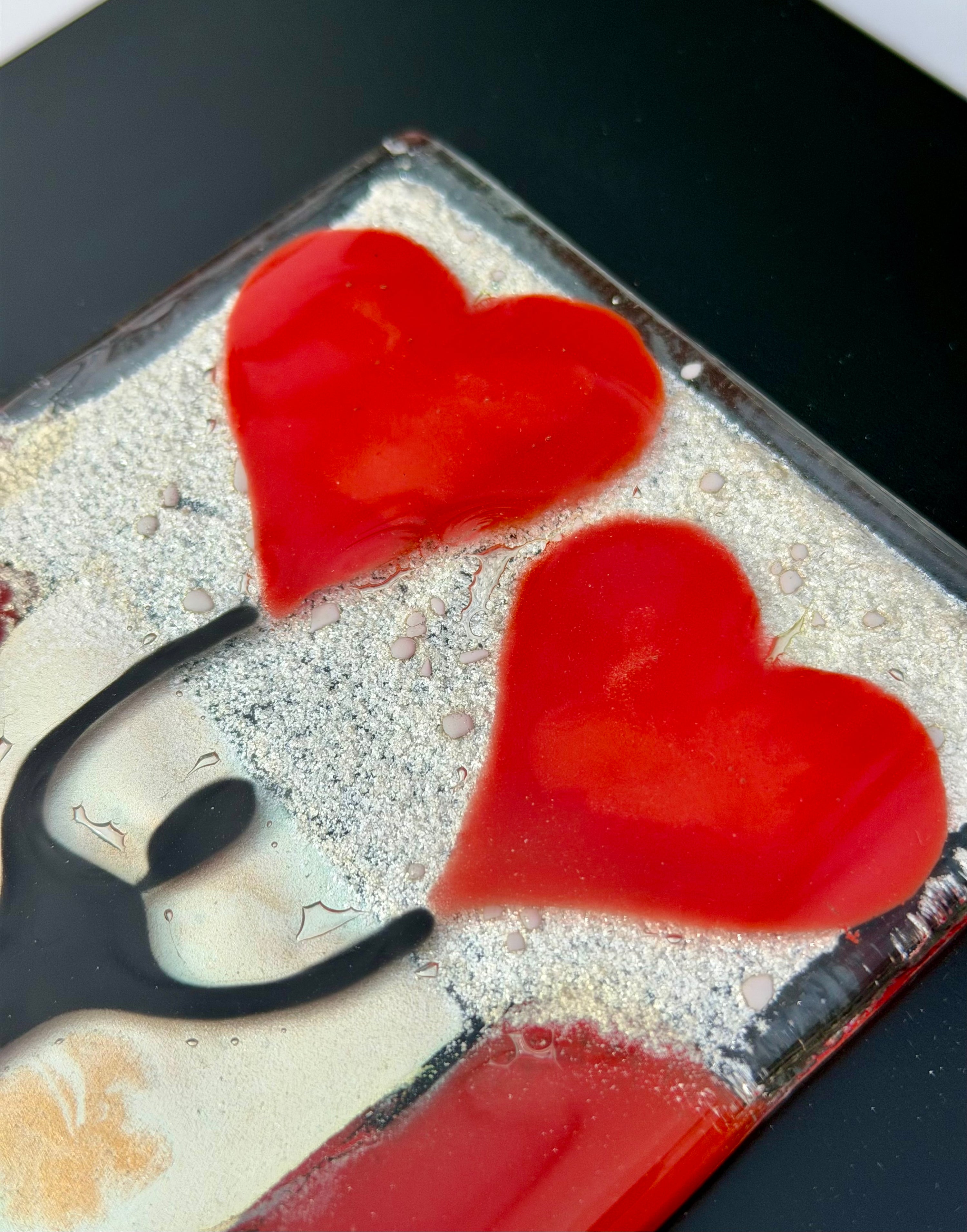Figure Holding Hearts - Fused Glass Wall Art with Black Panel