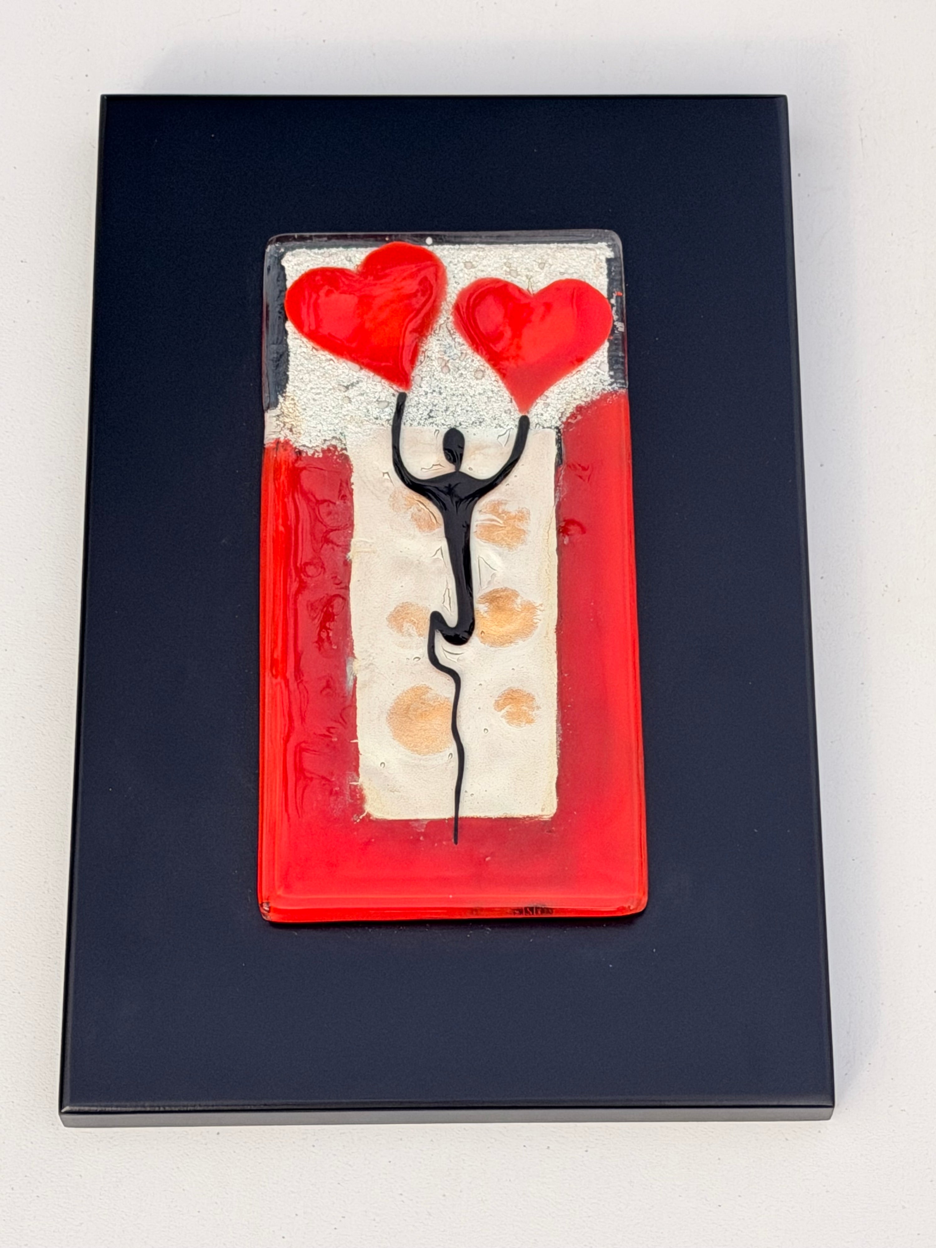 Figure Holding Hearts - Fused Glass Wall Art with Black Panel